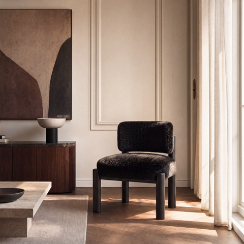 Fauteuil TOM fausse fourrure pieds noirs